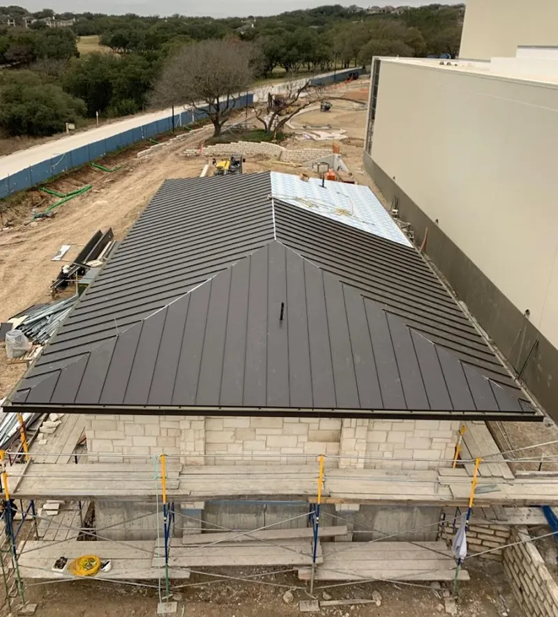 Metal roof new construction with scaffolding in Clinton